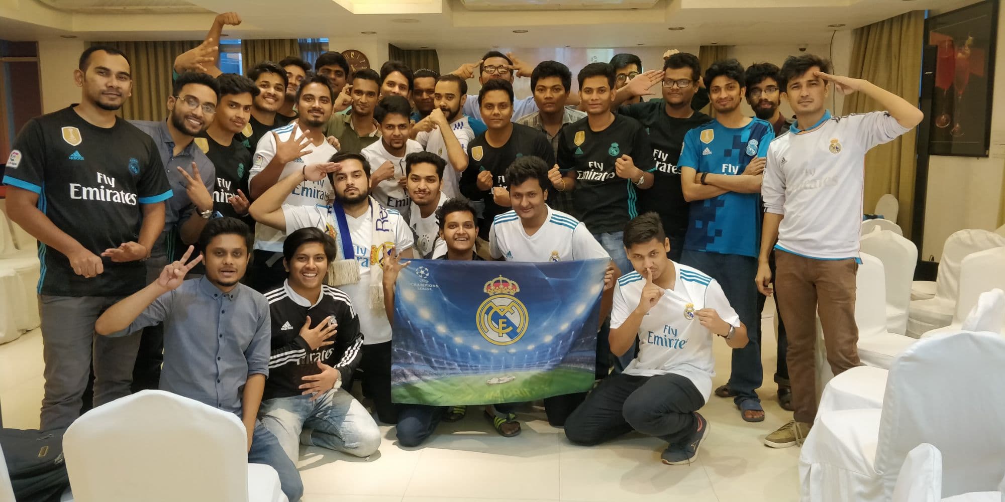 PMBD members posing with a Real Madrid Champions League flag at Platinum Suites, Banani, at 5:21am after the 2018 final
