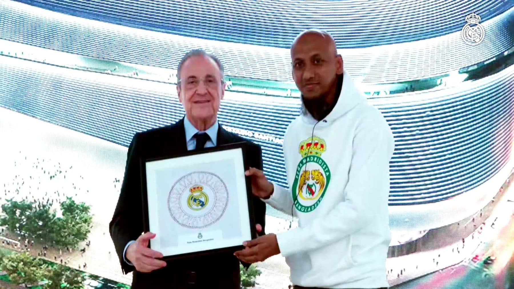 Florentino Pérez and a PMBD representative holding a framed nakshi kantha in Jeddah